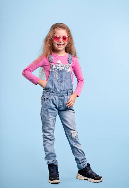Fashionable girl in denim overall - Photo, image