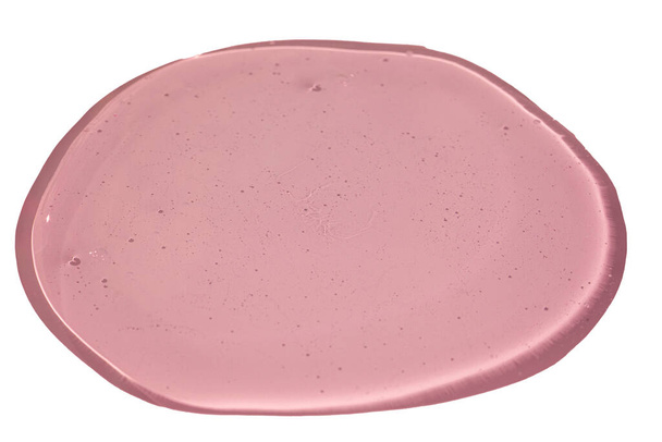 Bio rózsaszín kozmetikai folyékony gél textúra. Közelkép a kék átlátszó csepp bőrápoló termék. Fehér alapon elszigetelve.  - Fotó, kép