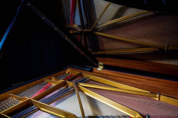 A close-up of the internal string structure of a top grand piano - Photo, Image