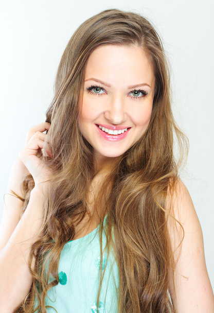 Beautiful young woman with curly long hair - Zdjęcie, obraz