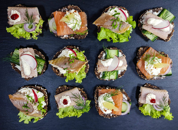Canapes with smoked fish and salad - Photo, image