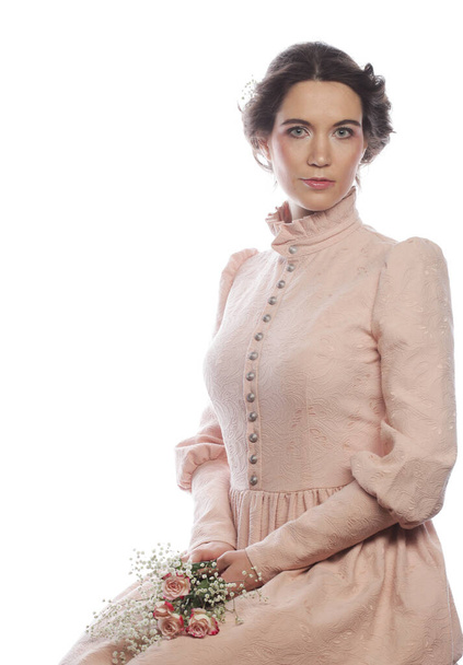 Young brunette woman wearing pink dress over white background. Fashion and people concept. - Φωτογραφία, εικόνα