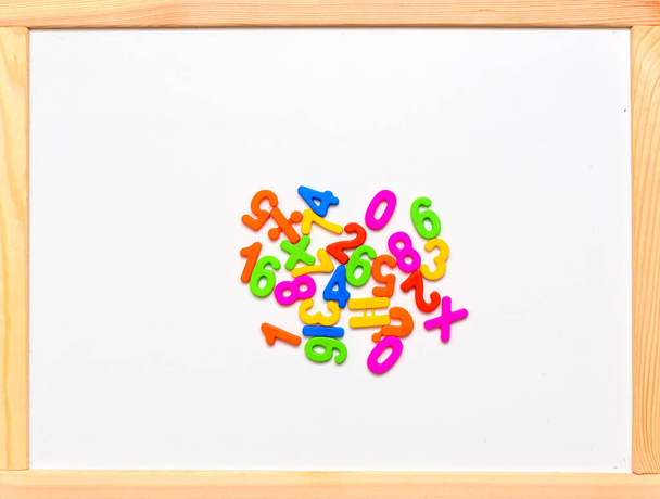 Children's numbers for teaching kids mathematics. View from above. The numbers are multicolored. - Fotografie, Obrázek