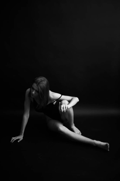 fashion monochrome portrait of sexy beautiful young woman in bodysuit.Sexy girl - Foto, Imagen