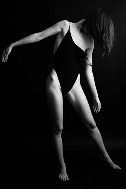 fashion monochrome portrait of sexy beautiful young woman in bodysuit.Sexy girl - Valokuva, kuva