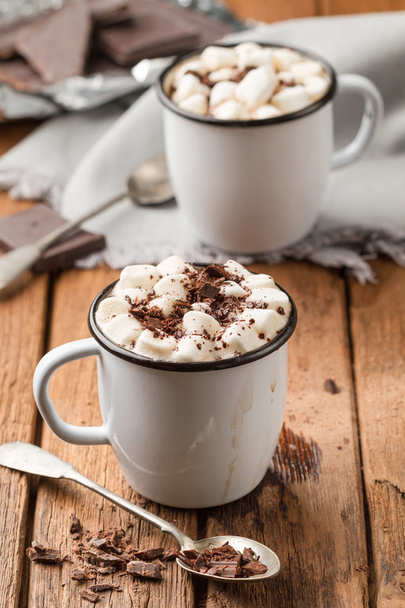 Hot chocolate with marshmallows in two enamelled tin mugs - Photo, Image