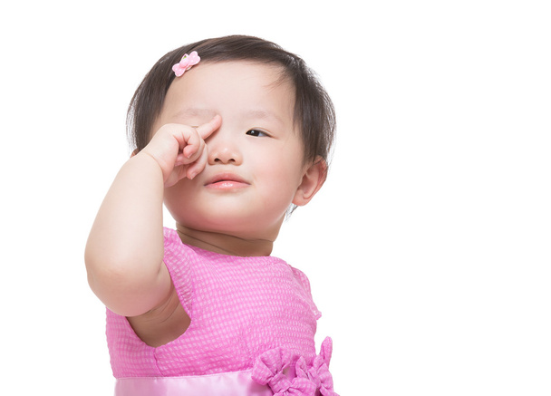 asijské malé děvče prst dotknout oka - Fotografie, Obrázek