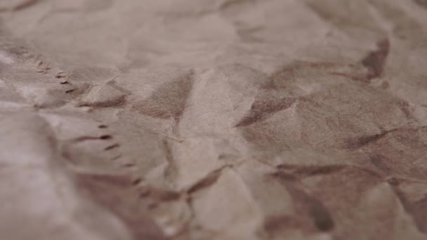 Wrapping crumpled wrinkled paper macro texture. Close up folds. Dolly Shot - Footage, Video