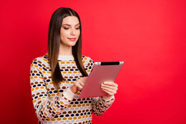 Photo portrait of pretty student using tablet e-reader smiling isolated bright red color background - Fotoğraf, Görsel