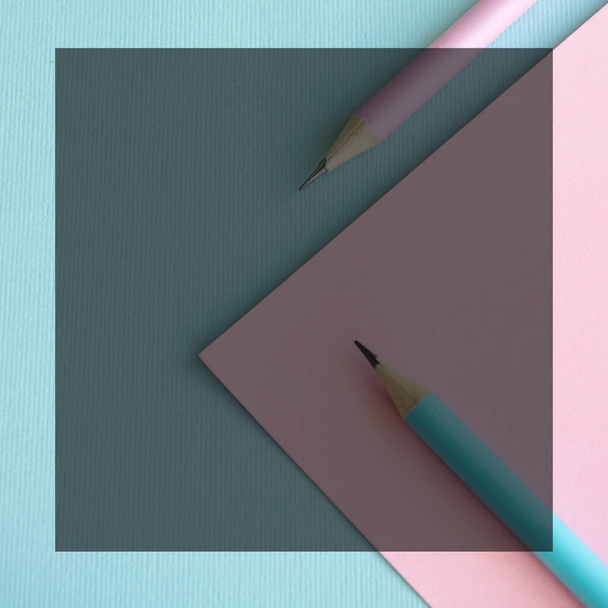 Pastel colored pencils on empty sheet, blue and pink tones - Photo, Image