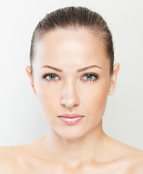 Beautiful face of young adult woman with clean fresh skin - Foto, immagini