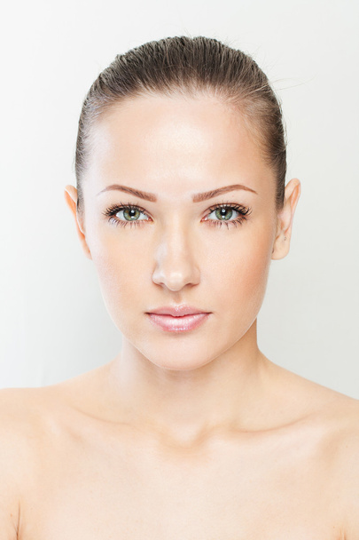 Beautiful face of young adult woman with clean fresh skin - Valokuva, kuva