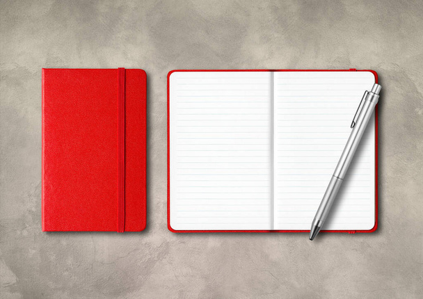 Red closed and open lined notebooks with a pen . Mockup isolated on concrete background - Foto, immagini