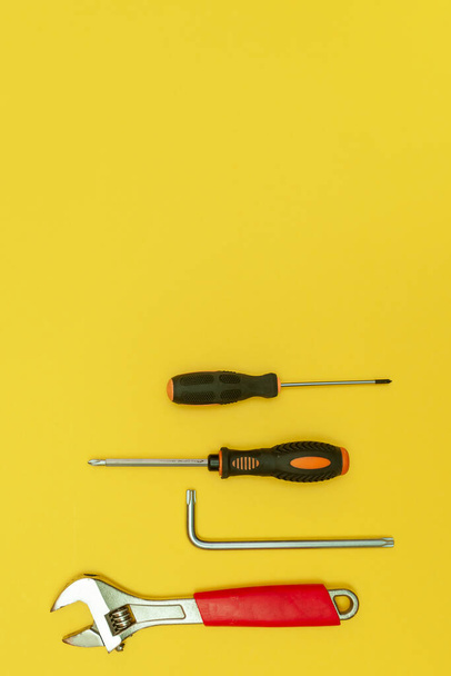 tools on isolated yellow background - Fotó, kép
