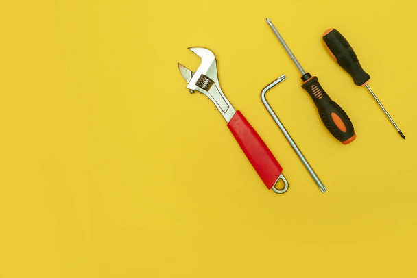 tools on isolated yellow background - Fotografie, Obrázek