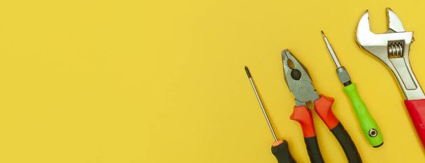tools on isolated yellow background panorama - Photo, Image