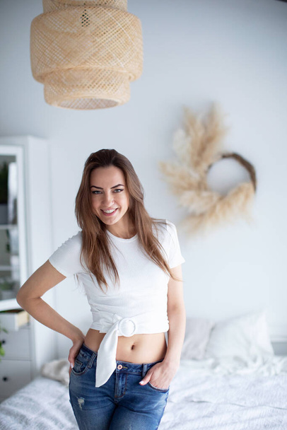 Young beautiful smiling woman in casual wear at home. Domestic life. - Fotoğraf, Görsel