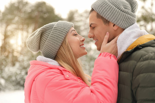 Beautiful happy couple outdoors on winter day - Zdjęcie, obraz