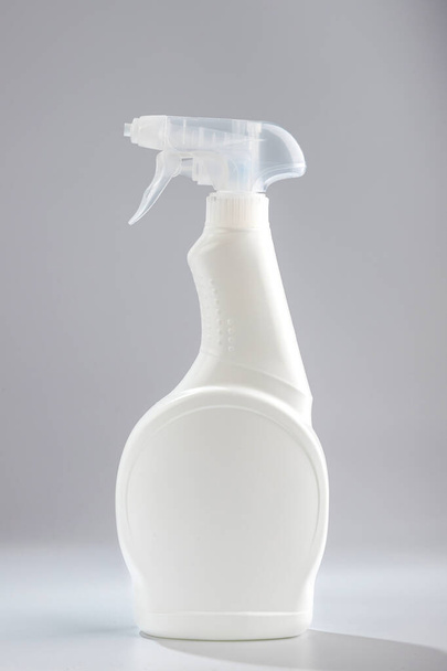 Detergent for windows and bathroom on a gray background - Foto, Imagem