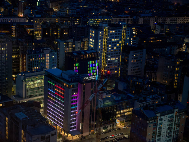 Milan Italy April 10 2019: Modern buildings of Milan in the central station area illuminated at night - Photo, Image