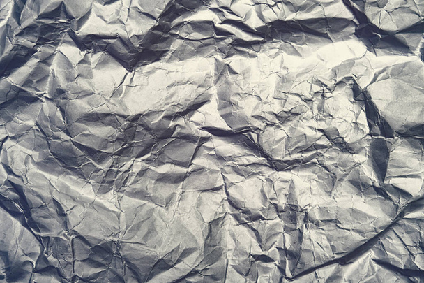 Gray crumpled shiny abstract paper background - Foto, imagen