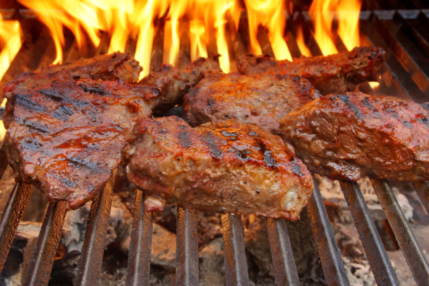 Beef Steak on the BBQ Grill with flames. - Photo, Image