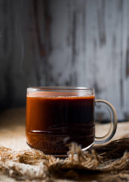 a cup of delicious hot chocolate in warm light - Photo, Image