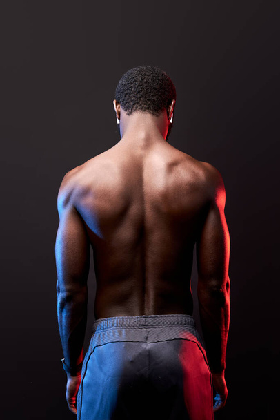 view from back on strong athlete black man - Foto, Imagem