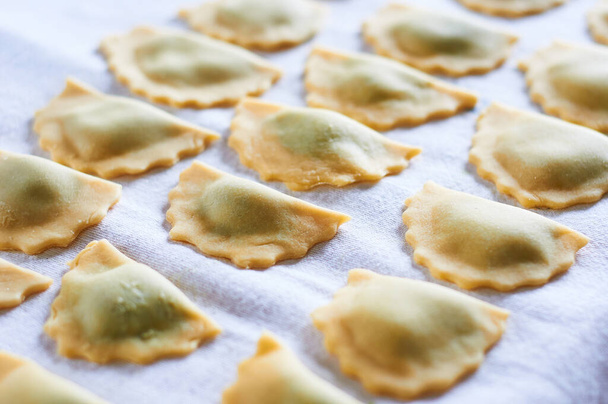 homemade ricotta and spinach ravioli ready to cook,Italy - Photo, Image