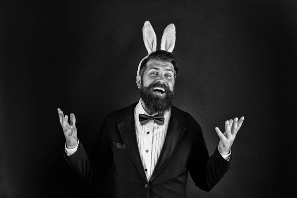 Celebrating spring equinox. Happy businessman black background. Bearded man smile with bunny ears. Enjoying Easter party. Pleasure and fun. Spring season. Springtime. Spring holidays. Spring is here - Foto, imagen