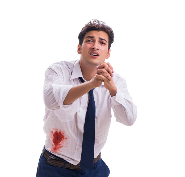 Hombre de negocios herido con manchas de sangre aisladas en el fondo blanco
 - Foto, Imagen