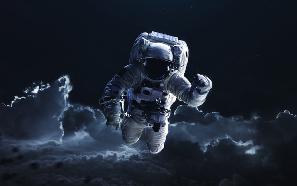 Astronaut. Deep space image, science fiction fantasy in high resolution ideal for wallpaper and print. Elements of this image furnished by NASA - Photo, Image