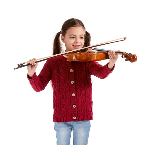Маленька дівчинка грає на скрипці на білому тлі
 - Фото, зображення