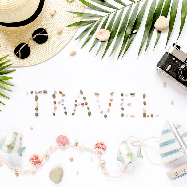 Traveler accessories, tropical palm leaf branches on white background. Travel vacation concept. Summer background. Road frame set. Flat lay, top view. - Φωτογραφία, εικόνα