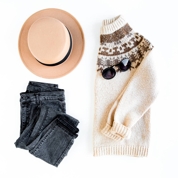 Women fashion clothes and accessories. Feminine youth collage top view. Flat lay female style look with warm sweater, jeans, boot. Top view. - Photo, image