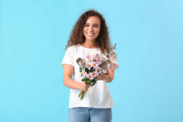 Beautiful woman with flowers on color background. International Women's Day celebration - Foto, Imagen