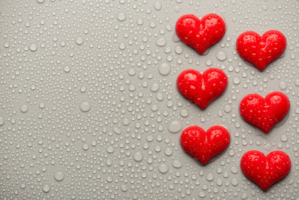 Overhead top above close up view photo of valentine day red hearts on grey backdrop with drops - Φωτογραφία, εικόνα
