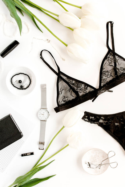 Flat lay stylish, sexy, black lingerie, accessories on a white background. Top view.  - Foto, afbeelding