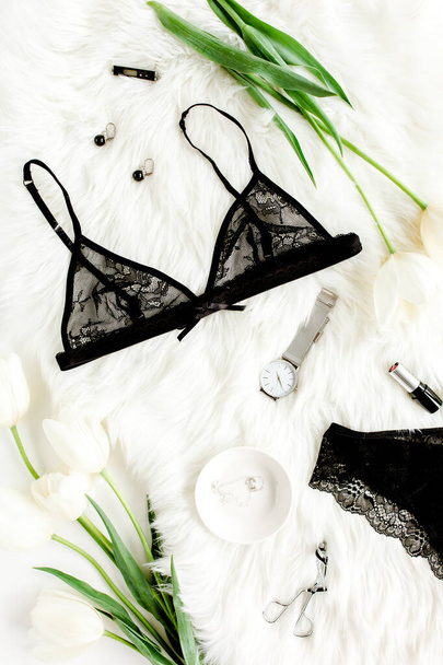 Flat lay stylish, sexy, black lingerie, accessories on a white background. Top view.  - Фото, изображение