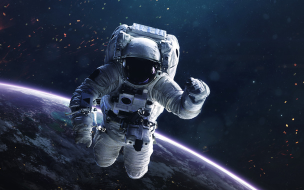 Astronaut. Deep space image, science fiction fantasy in high resolution ideal for wallpaper and print. Elements of this image furnished by NASA - Photo, Image