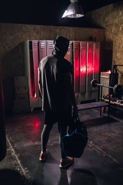 Man get ready for boxing training in the locker room - Foto, imagen