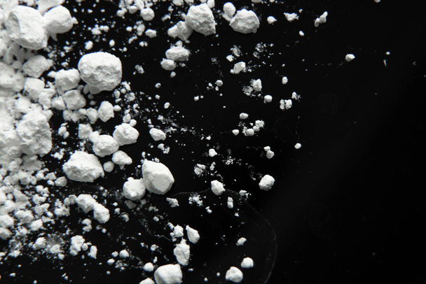 black glass background and scattered flour, backdrop background - Photo, Image