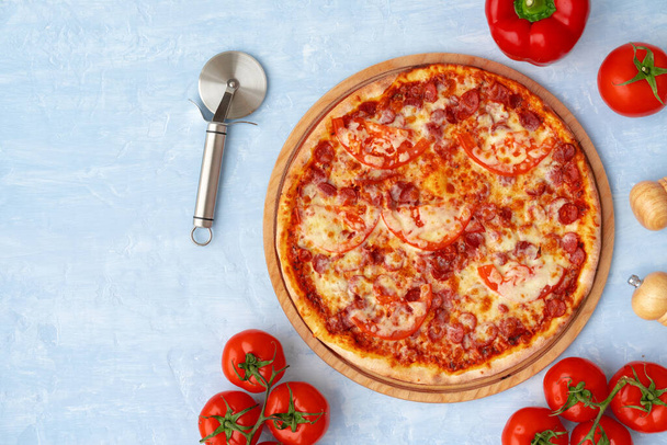 Delicious pizza with sausages on gray background - Foto, immagini