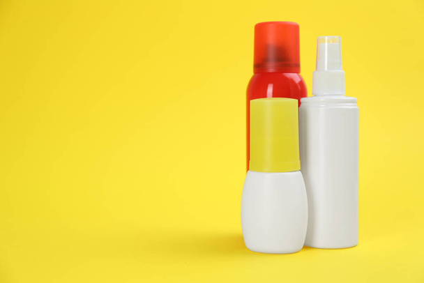 Set of different insect repellents on yellow background. Space for text - Fotó, kép