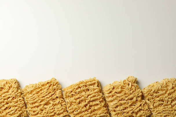 Flat lay with instant noodles on white background - Photo, Image