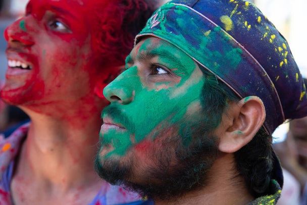 Jodhpur, rajastha, india - March 20, 2020: Young indian men celebrating holi festival, closeup of face covered with green colored powder. - Photo, image