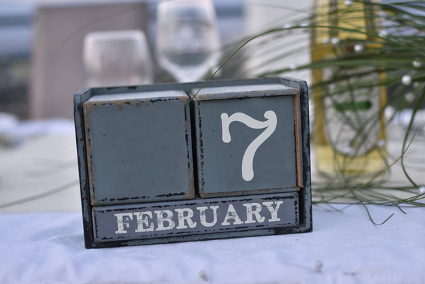 Wood blocks in box with date, day and month 7 February. Wooden blocks calendar - Photo, Image