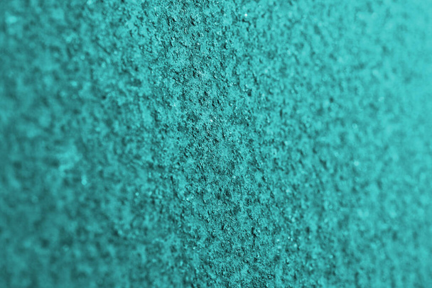 Rusty surface tinted in aquamarine. Metal background or wallpaper. Abstract turquoise textured backdrop. Rough matte surface. Macro - Zdjęcie, obraz