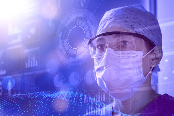 Female scientist wearing lab glasses and protective mask examines data on a transparent digital screen. Concept of innovative technology in medical research, HUD styl - Foto, Bild