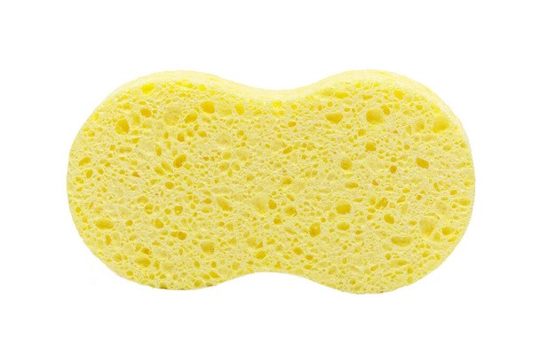 bright yellow absorbent car cleaning sponge against a pure white background. - Photo, Image